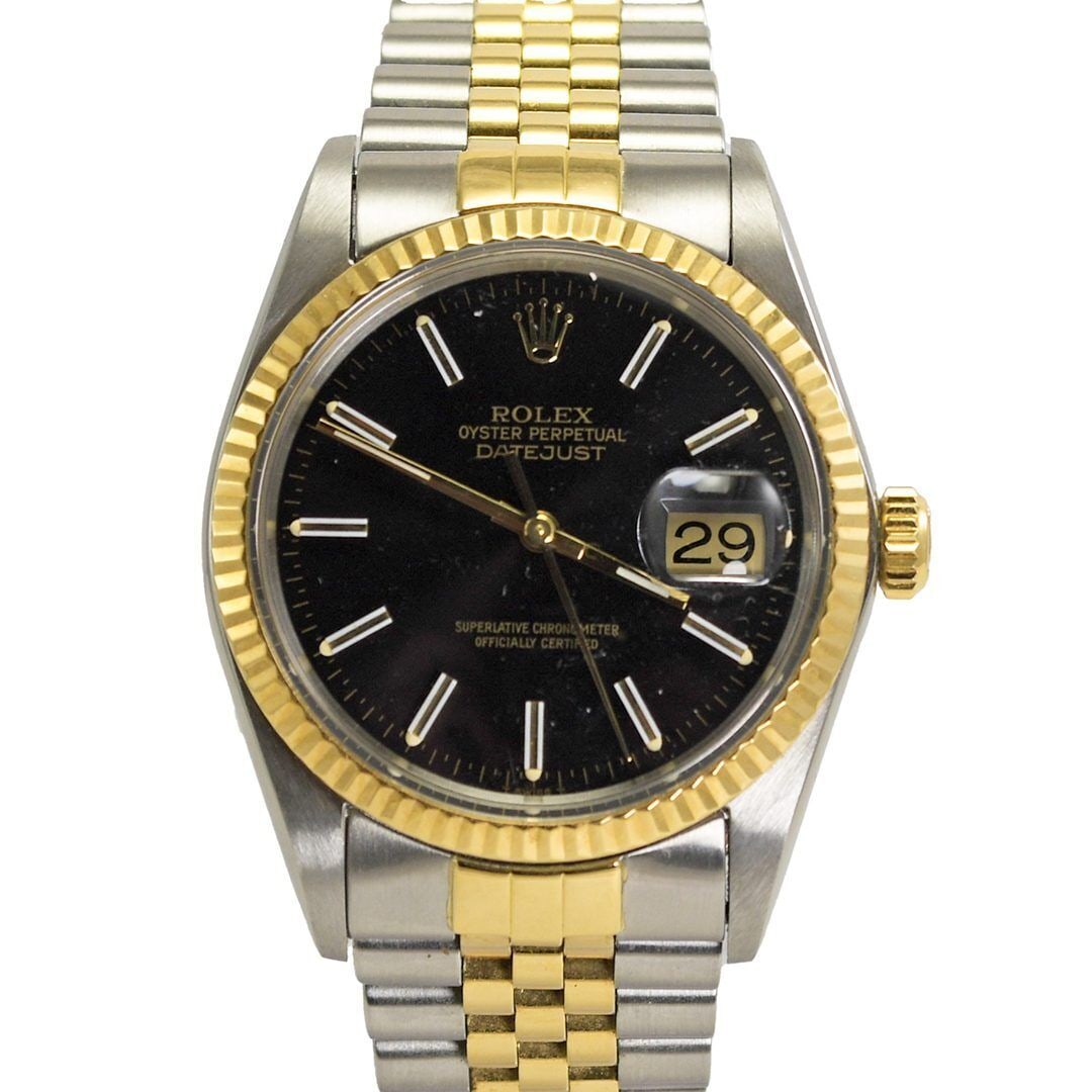 Rolex 1984 Two-Tone Datejust Wristwatch Black Dial 36mm: Rolex 1984 Two-Tone Datejust Wristwatch Black Dial 36mm This vintage 1984 Rolex Datejust features a round case design and a striking black dial. It is crafted from two-tone materials, including 18k ye