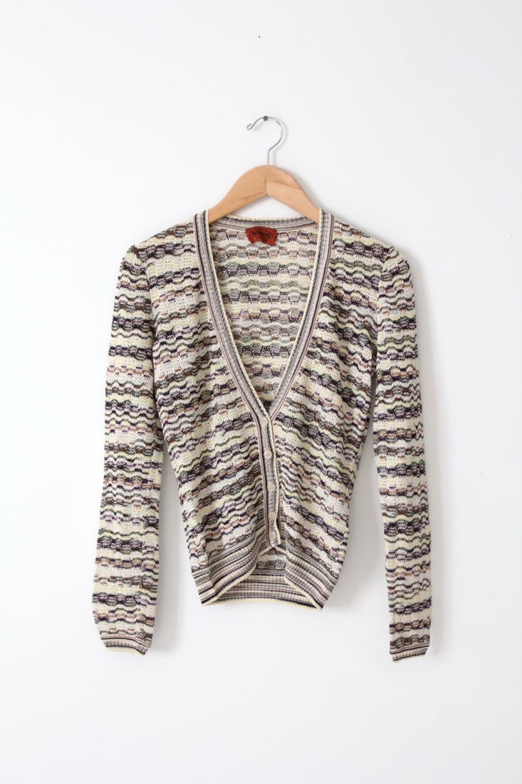 Vintage Missoni Cardigan with Zig-Zag Pattern: Vintage Missoni Cardigan with Zig-Zag Pattern This vintage Missoni cardigan features a stylish white, cream, black, purple, and brown zig-zag woven pattern. Made in Italy, the cardigan is crafted from