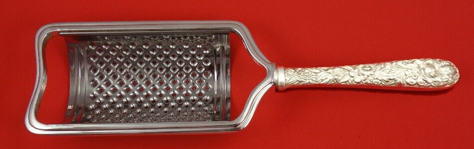 Kirk Sterling Silver Repousse Cheese Grater Curved 8.5in Custom Made: Kirk Sterling Silver Repousse Cheese Grater Curved 8.5in Custom Made This custom made cheese grater from Kirk features a beautiful Repousse pattern and a curved design. Made from sterling silver with