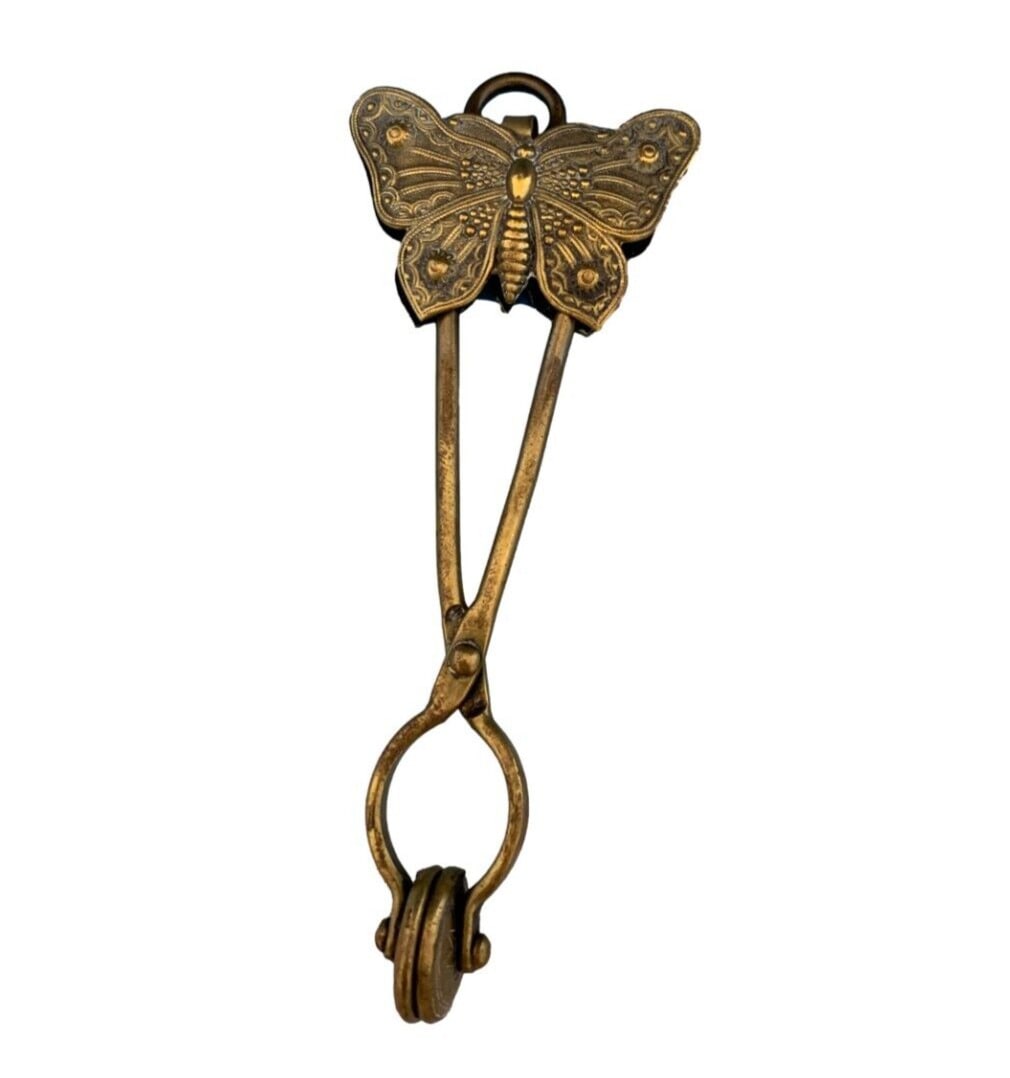 Victorian Brass Skirt Lifter with Large Butterfly Design: Victorian Brass Skirt Lifter with Large Butterfly Design This Victorian brass skirt lifter features a large butterfly design on both sides. Measuring 5.5 inches long, it showcases a butterfly that mea