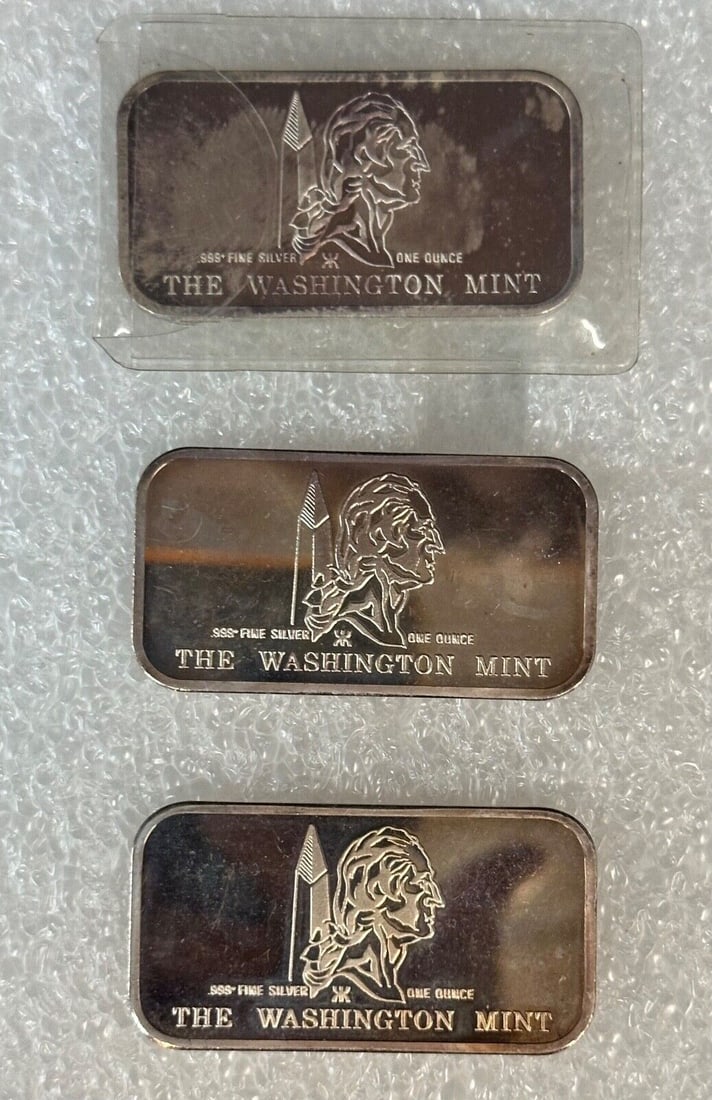 Three Vintage One Ounce Sterling Silver Bars from Washington Mint: Three Vintage One Ounce Sterling Silver Bars from Washington Mint This listing features three vintage sterling silver bars issued by the Washington Mint between the years 1949 and 1974. Each bar conta