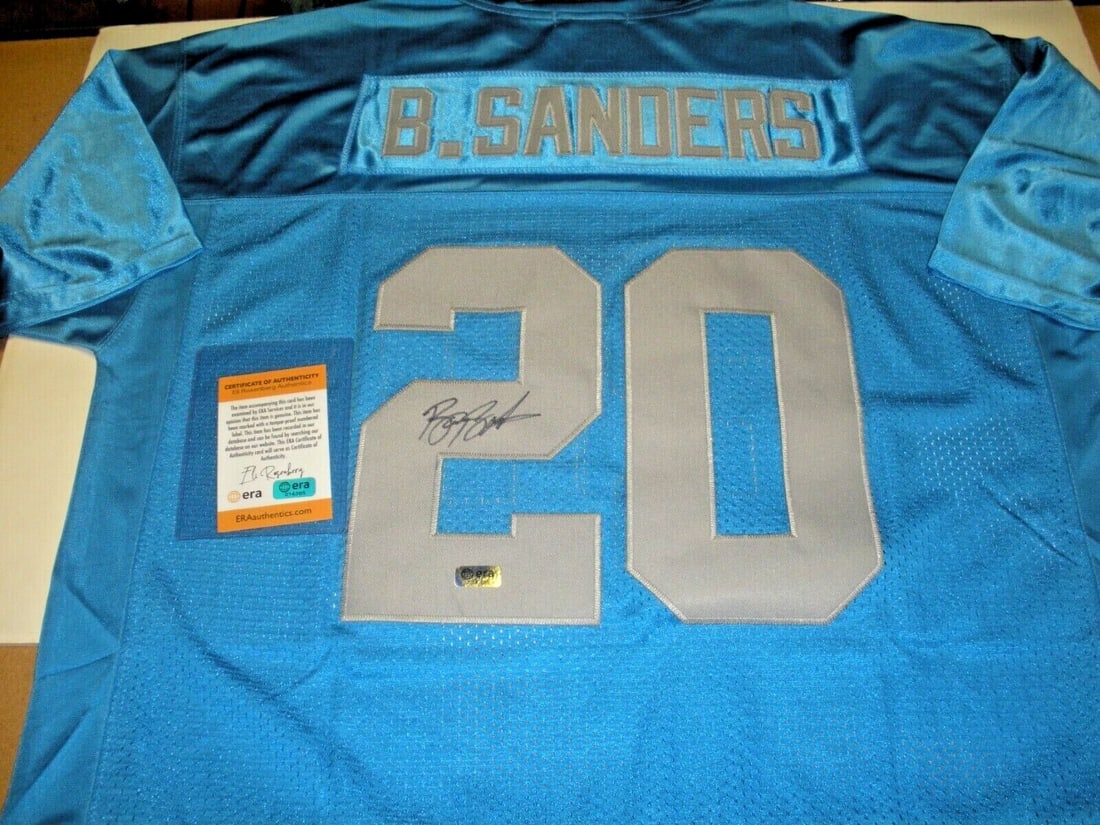 Barry Sanders Detroit Lions Signed Jersey with COA: Barry Sanders Detroit Lions Signed Jersey with COA This is an official licensed Mitchell & Ness jersey signed by Barry Sanders, featuring a Certificate of Authenticity (COA). Perfect for any Detroit L