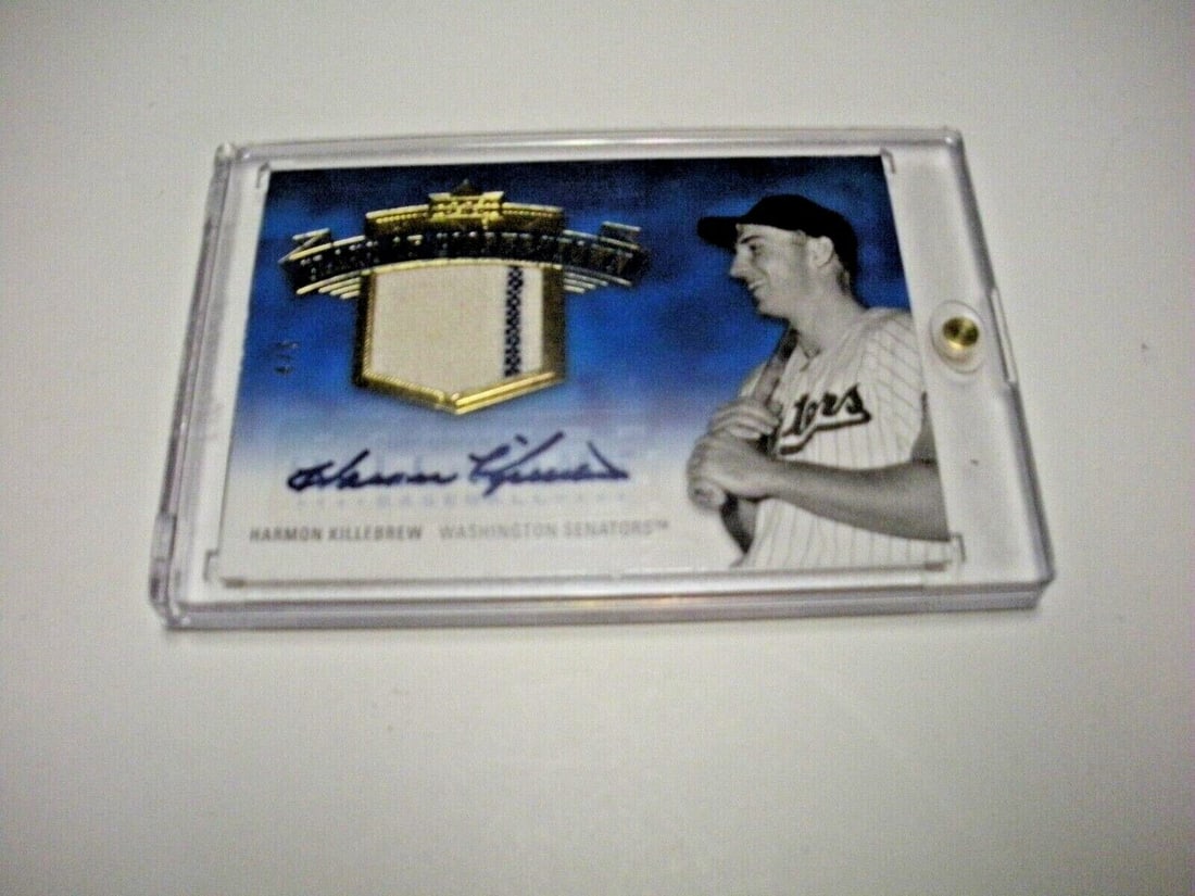 Harmon Killebrew 05 Upper Deck Game Used Jersey Autographed Card: Harmon Killebrew 05 Upper Deck Game Used Jersey Autographed Card This collectible baseball card features Harmon Killebrew of the Washington Senators, showcasing him holding a bat and wearing a striped