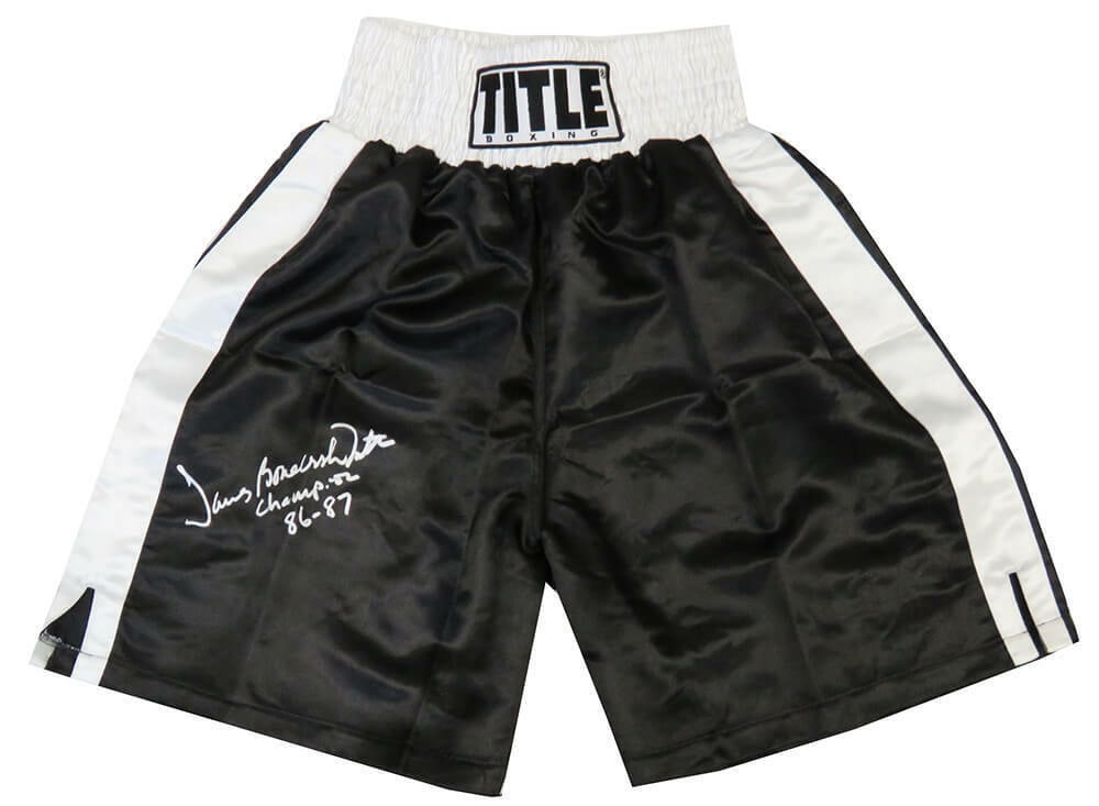 James Smith Signed Boxing Trunks Black & White Champion 86-87: James Smith Signed Boxing Trunks Black & White Champion 86-87 Black & white boxing trunks signed by James Smith, a Heavyweight Champion. The trunks are in pristine condition and feature an inscription