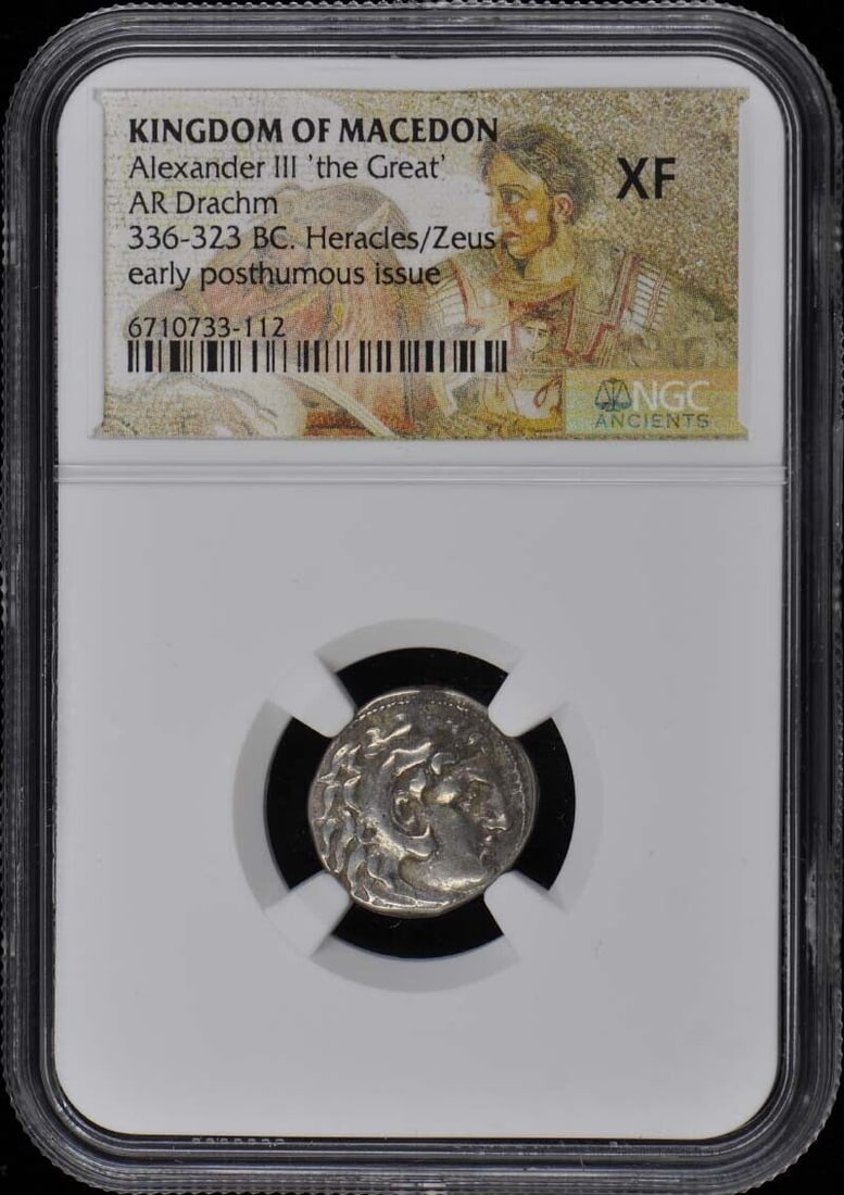 Alexander III the Great Macedon AR Drachm Coin NGC XF40: Alexander III the Great Macedon AR Drachm Coin NGC XF40 This ancient silver coin from the Kingdom of Macedon features Alexander III the Great. The obverse depicts Heracles/Zeus wearing a lion's skin, 