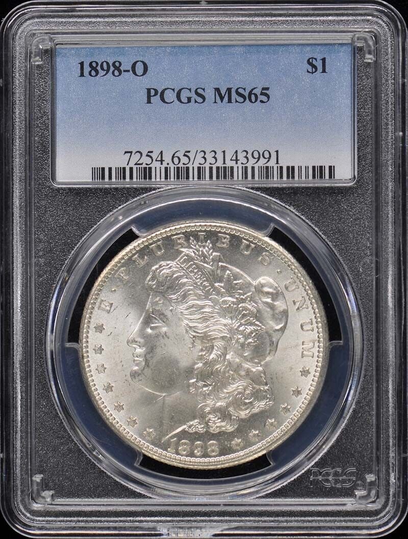 1898-O Morgan Silver Dollar Coin, Graded MS65 by PCGS, New Orleans Mint: 1898-O Morgan Silver Dollar Coin, Graded MS65 by PCGS, New Orleans Mint This 1898-O Morgan Dollar is graded MS65 by PCGS and is in uncirculated condition. The coin features the iconic design of Lady L