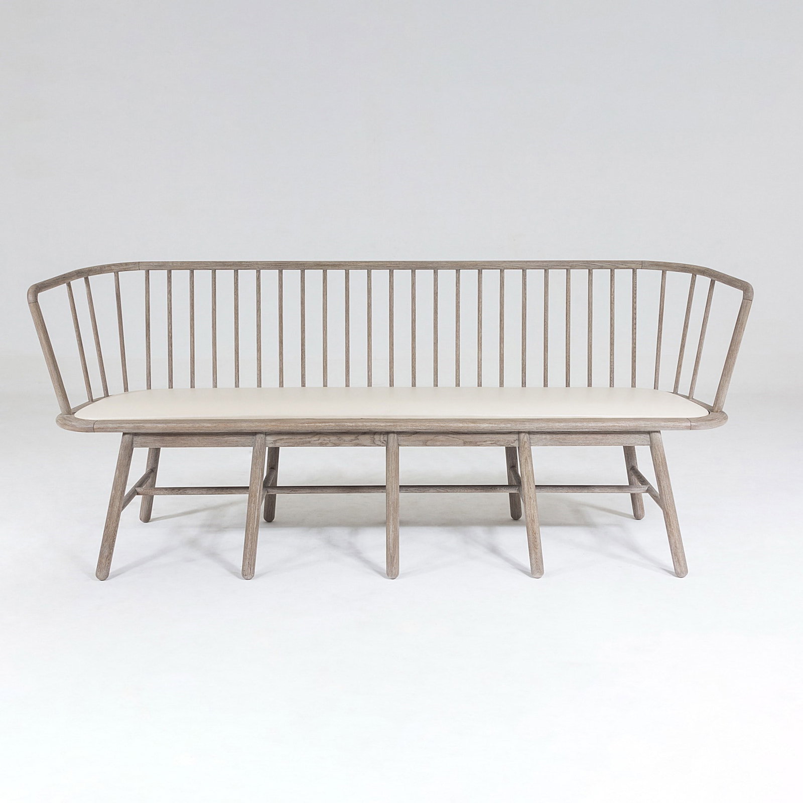 Spindle Long Bench In Beige Leather: Spindle Long Bench In Beige Leather Taking a cue from understated, yet meticulously well-designed Shaker style furniture, the Spindle Long Bench offers an updated twist on a classic silhouette. Crafte