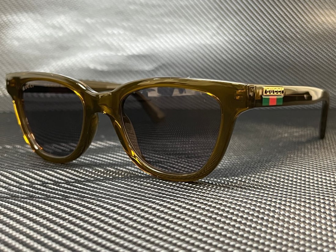 GUCCI GG1116S 004 Brown Rectangle Sunglasses: GUCCI GG1116S 004 Brown Rectangle Sunglasses Introducing the GUCCI GG1116S 004 Brown Rectangle Sunglasses, featuring a stylish brown rectangular frame. These sunglasses are designed for men and are pe