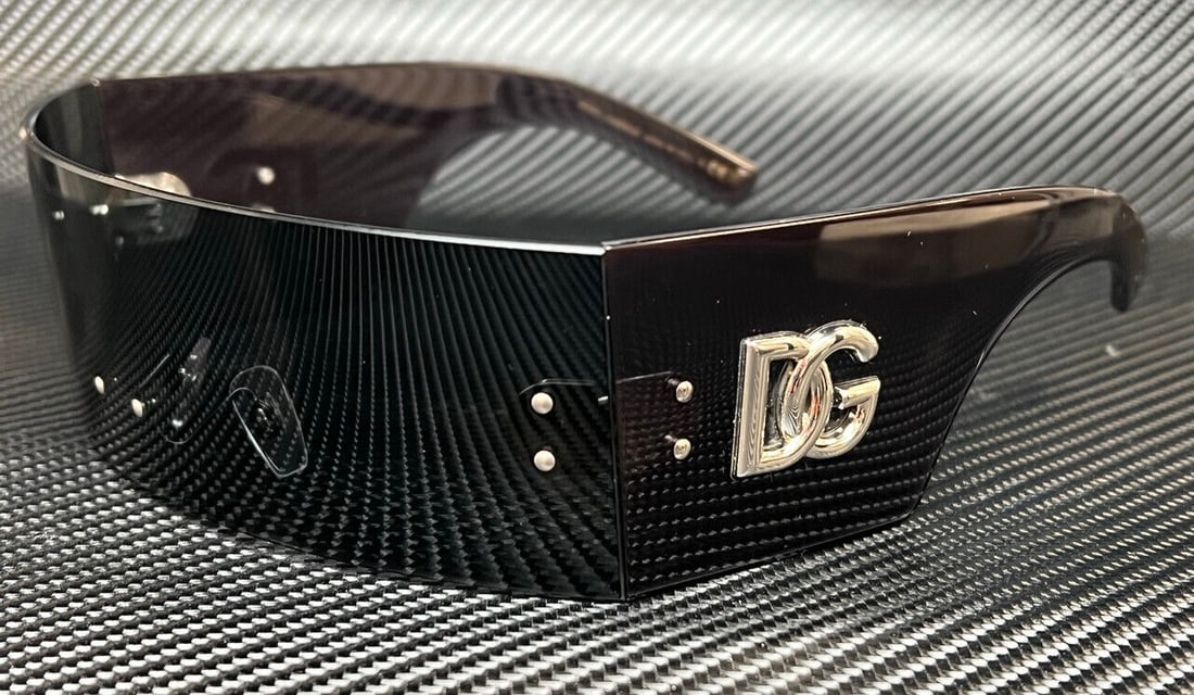 DOLCE & GABBANA DG6183 Dark Grey Women's Sunglasses 140 mm: DOLCE & GABBANA DG6183 Dark Grey Women's Sunglasses 140 mm Stylish DOLCE & GABBANA DG6183 sunglasses featuring a beige frame color. Designed for women, these sunglasses have a lens width of 140 mm, ma