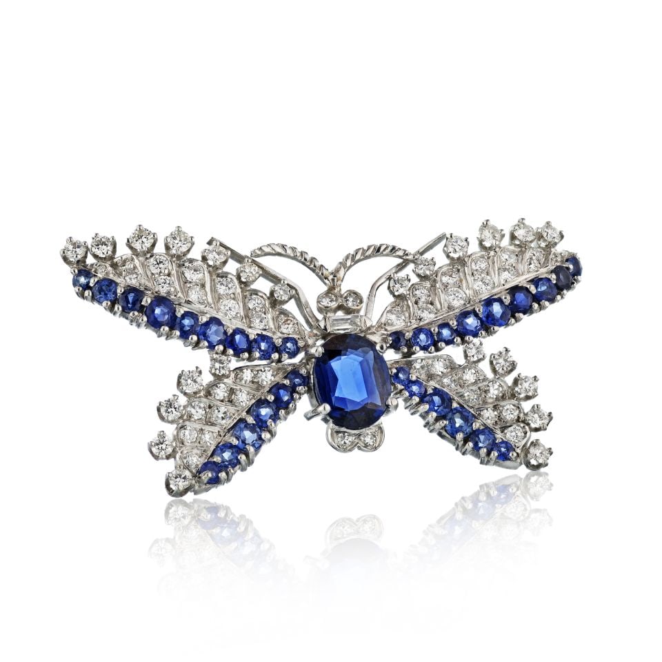 Bailey Banks & Biddle Platinum Butterfly Brooch with 3.00 Carat Sapphire and Diamond Accents: Bailey Banks & Biddle Platinum Butterfly Brooch with 3.00 Carat Sapphire and Diamond Accents This stunning butterfly brooch by Bailey Banks & Biddle is crafted in platinum and features a central 3.00 