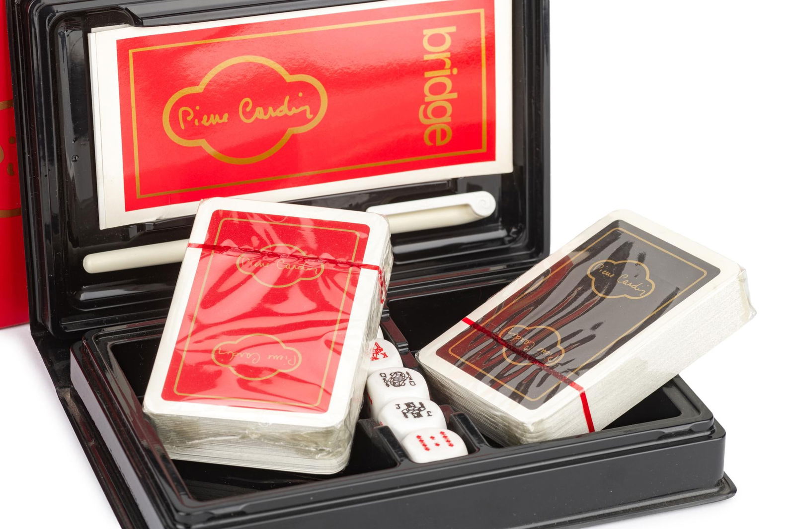Pierre Cardin Vintage Poker Set with Two Decks of Cards and Dice: Pierre Cardin Vintage Poker Set with Two Decks of Cards and Dice This vintage poker set by Pierre Cardin features two decks of bridge playing cards, one red and one black housed in a stylish black cas