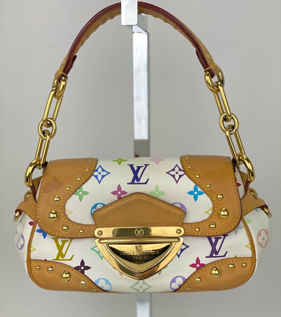 Louis Vuitton Multicolor Marilyn White Shoulder Bag with Gold Hardware: Louis Vuitton Multicolor Marilyn White Shoulder Bag with Gold Hardware This vintage Louis Vuitton shoulder bag features a distinctive multicolore pattern on a white exterior. The bag is constructed fr