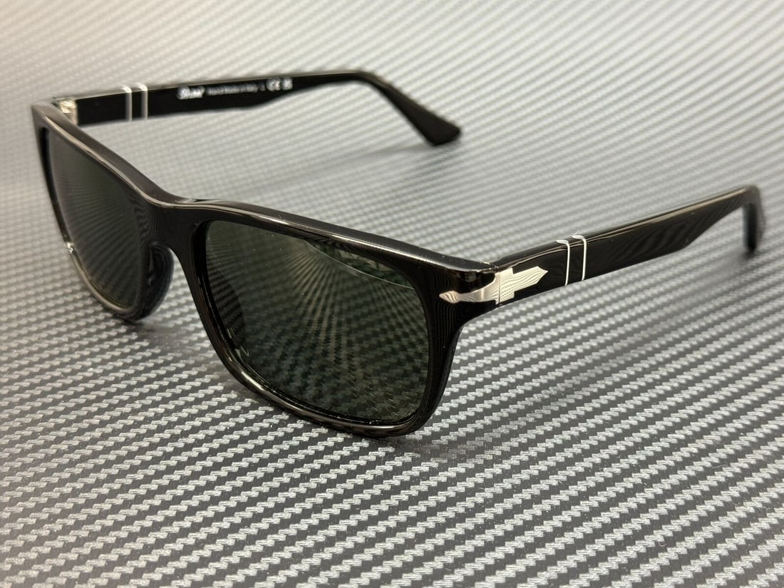 Persol PO3048S Black Rectangle Sunglasses with Green Polarized Lenses: Persol PO3048S Black Rectangle Sunglasses with Green Polarized Lenses Introducing the Persol PO3048S sunglasses, featuring a classic rectangle design in a solid black frame. These stylish sunglasses a