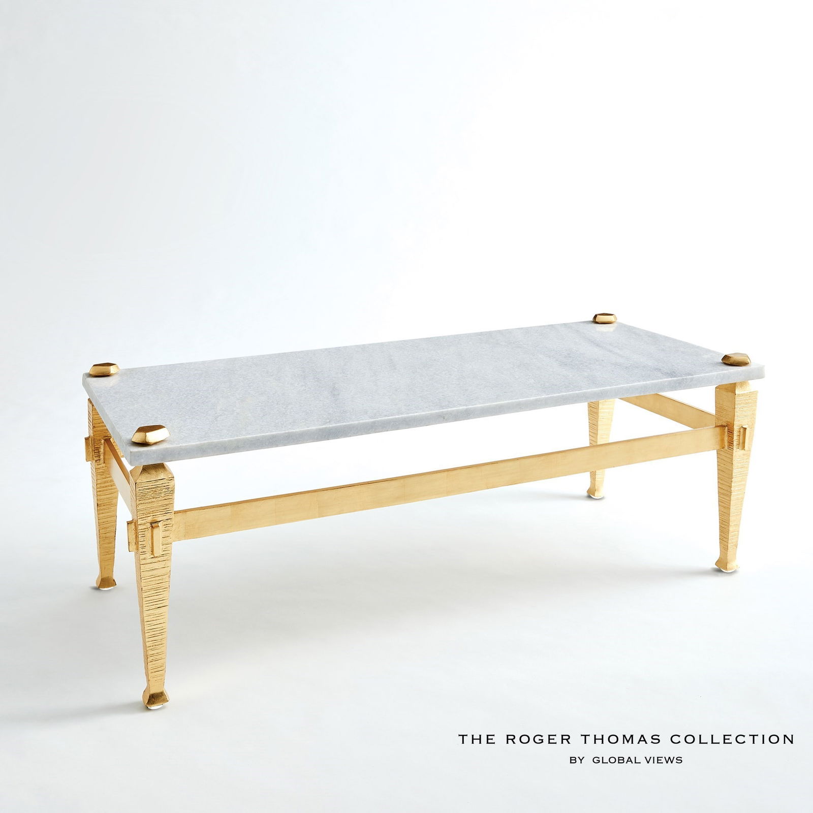 Roman Coffee Table In Gold: Roman Coffee Table In Gold The Roman collection by Roger Thomas draws inspiration from two notable sources. The silhouette of the leg was inspired by pieces crafted by Thomas Chippendale. The horizont