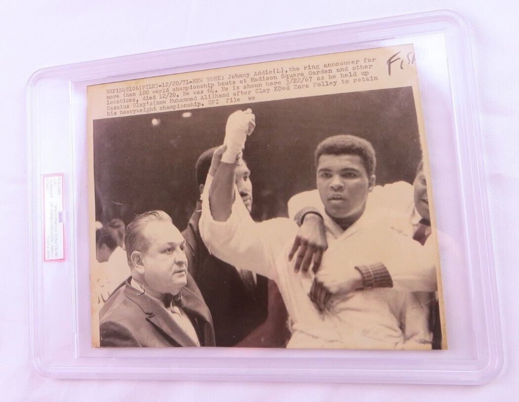Muhammad Ali Unsigned 1971 Boxing Photo with Johnny Addie 8x10 PSA: Muhammad Ali Unsigned 1971 Boxing Photo with Johnny Addie 8x10 PSA This is an original unsigned wire photo featuring boxing legend Muhammad Ali alongside Johnny Addie from 1971. Authenticated by Profe