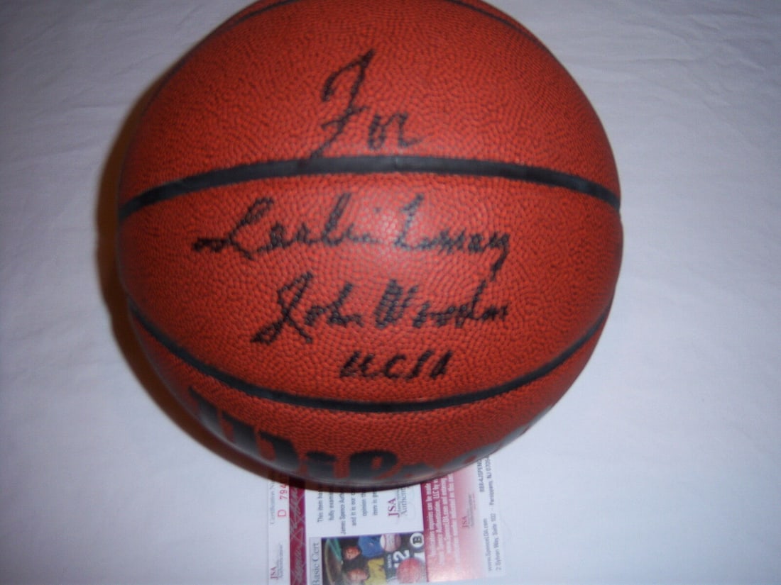 John Wooden UCLA Bruins Signed Basketball with JSA COA: John Wooden UCLA Bruins Signed Basketball with JSA COA JOHN WOODEN UCLA BRUINS HOF TO LESLIE JSA/COA SIGNED BASKETBALL. Product: Ball. Sport: Basketball-NBA. Original/Reprint: Original. Pre-Owned Whil