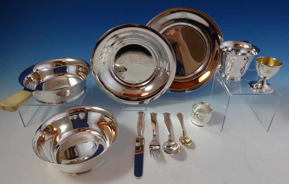 Tiffany and Co Sterling Silver 11-Piece Child's Set with Gold Washed Egg Cup: Tiffany and Co Sterling Silver 11-Piece Child's Set with Gold Washed Egg Cup This Tiffany and Co Sterling Silver Child's Set comprises 11 pieces, crafted with precision and care. The set includes a pl