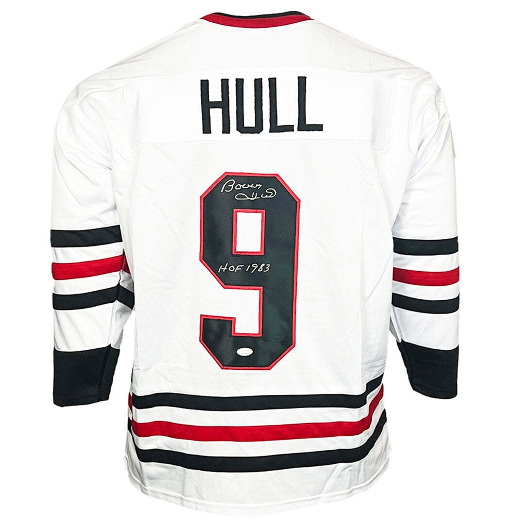 Bobby Hull Signed HOF 1983 Chicago White Hockey Jersey XL: Bobby Hull Signed HOF 1983 Chicago White Hockey Jersey XL This professional style white custom replica hockey jersey is autographed by Bobby Hull, featuring the HOF 1983 inscription. It is authenticat