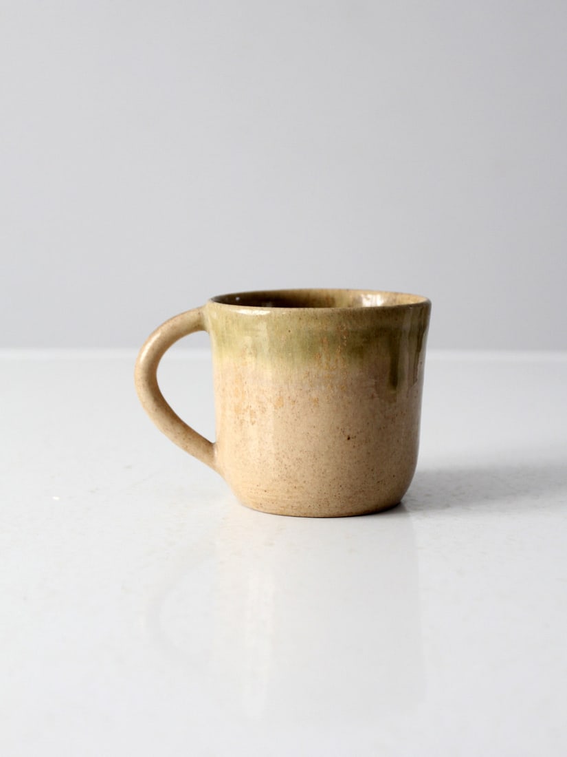 Eugene Deutch Vintage Pottery Mug with Ecru Glaze and Green Accents: Eugene Deutch Vintage Pottery Mug with Ecru Glaze and Green Accents This is a Eugene Deutch pottery mug circa 1950s. The hand-crafted art studio mug features an ecru glaze with pale green accents. Wid