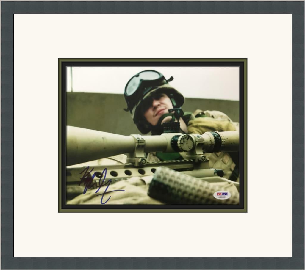 Kyle Gallner Signed American Sniper Custom Framed Photograph with PSA/DNA COA: Kyle Gallner Signed American Sniper Custom Framed Photograph with PSA/DNA COA This custom framed photograph features Kyle Gallner from the movie American Sniper. The photo measures 8x10 inches and is