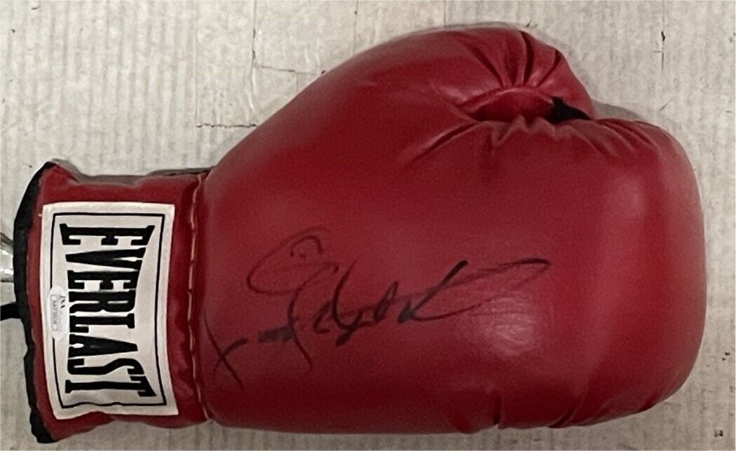 Sugar Ray Leonard Signed Boxing Glove with JSA Authentication: Sugar Ray Leonard Signed Boxing Glove with JSA Authentication This original boxing glove is signed by Sugar Ray Leonard, the Undisputed Welterweight Champion. Authenticated by James Spence (JSA), this