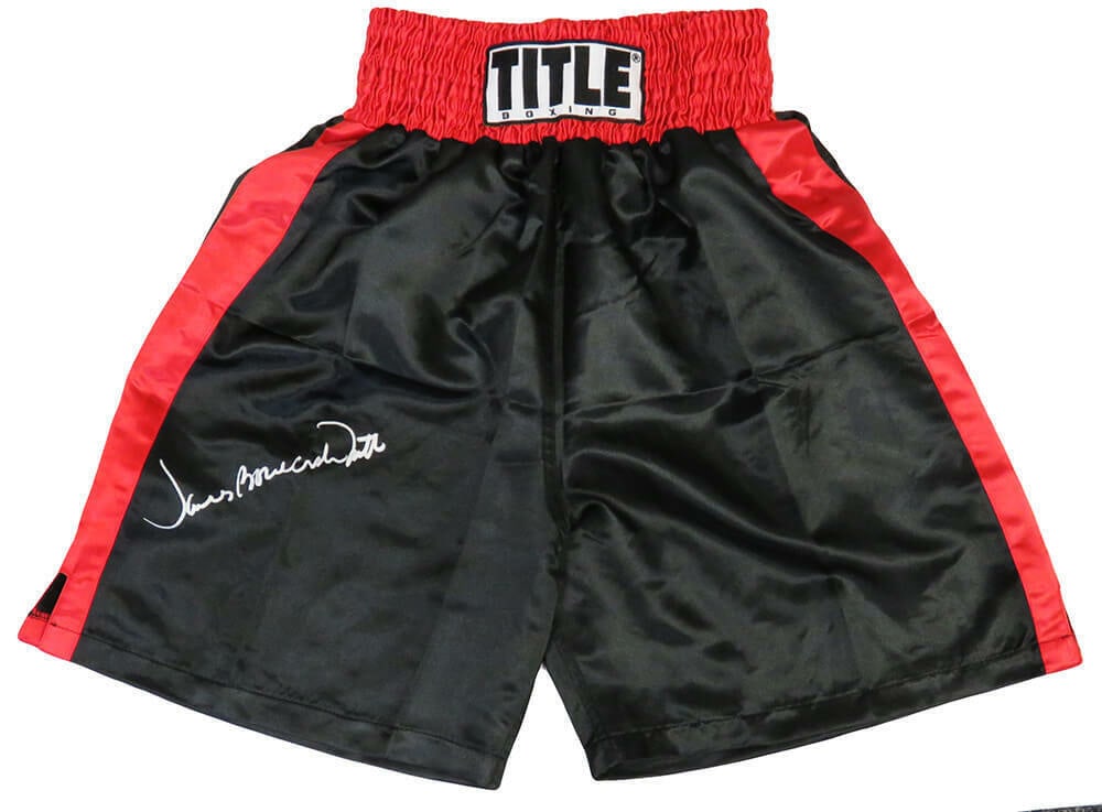 James Smith Signed Boxing Trunks with Red Trim: James Smith Signed Boxing Trunks with Red Trim James Smith signed boxing trunks featuring a black fabric with red trim. The trunks are authenticated by Schwartz Sports Memorabilia and indicate that Sm