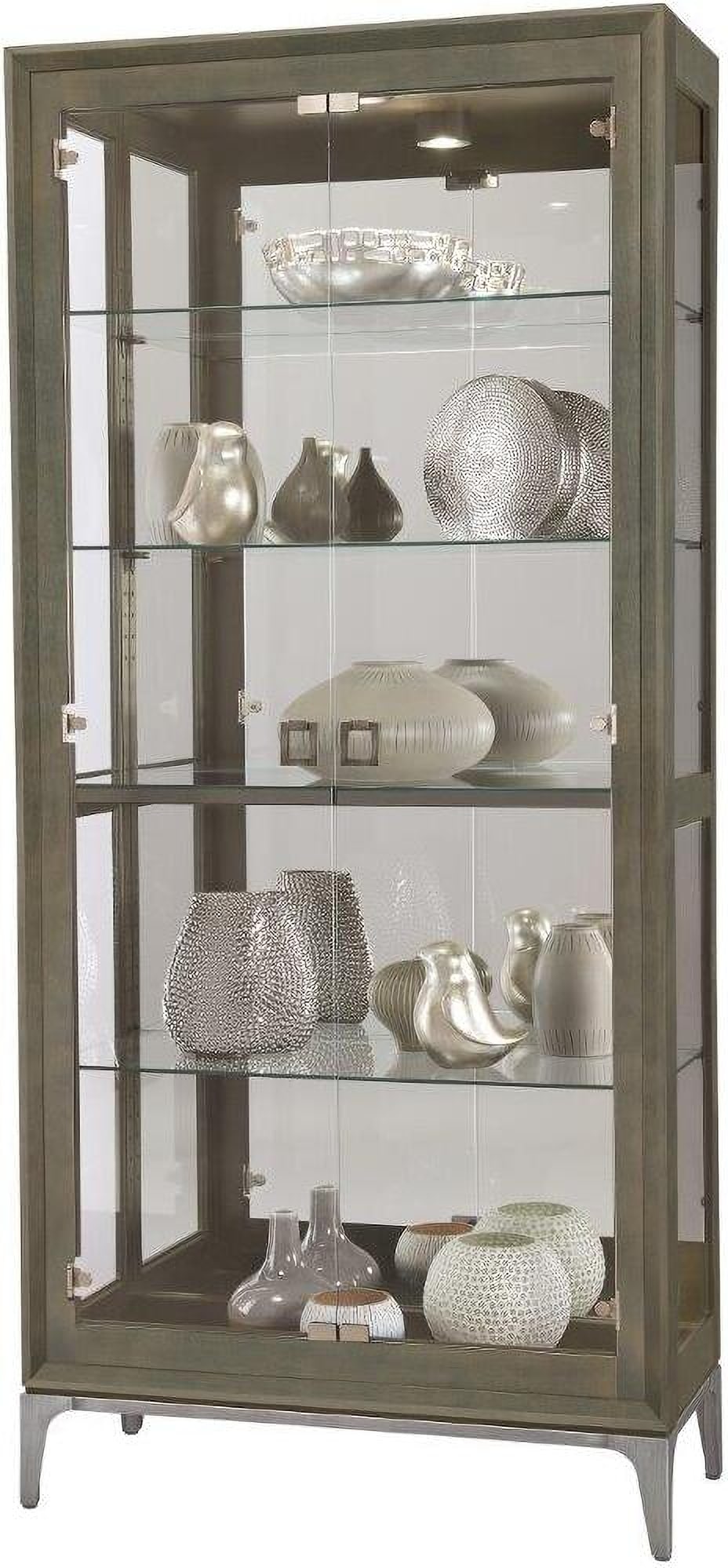 Howard Miller Sheena III Lighted Curio Cabinet Smoke Gray Finish: Howard Miller Sheena III Lighted Curio Cabinet Smoke Gray Finish Showcase your decorative objects with the Sheena IIi curio cabinet, featuring four adjustable glass shelves and interior lighting for c