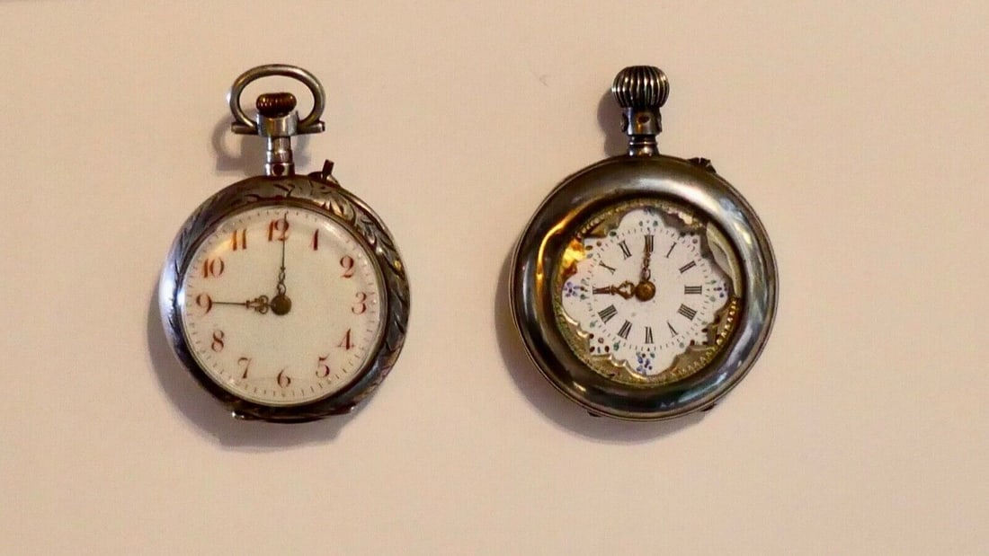 Set of 2 Victorian Ladies Silver Pocket Watches 800S: Set of 2 Victorian Ladies Silver Pocket Watches 800S This listing features two Victorian era ladies pocket watches, both with silver cases. The first watch is a silver open face model with a white ena