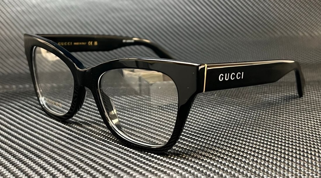 GUCCI GG1133O 001 Black Gold Full Rim Cat Eye Eyeglasses 52 mm: GUCCI GG1133O 001 Black Gold Full Rim Cat Eye Eyeglasses 52 mm Stylish GUCCI GG1133O 001 eyeglasses featuring a solid black color with gold accents. The full rim cat eye style is crafted from durable