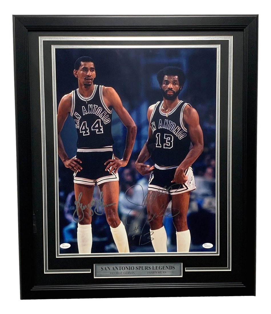 George Gervin Autographed Framed 16x20 Photo Spurs JSA Authentic: George Gervin Autographed Framed 16x20 Photo Spurs JSA Authentic This is an original autographed 16x20 photo of George Gervin, a prominent figure in basketball, framed and ready for display. The photo