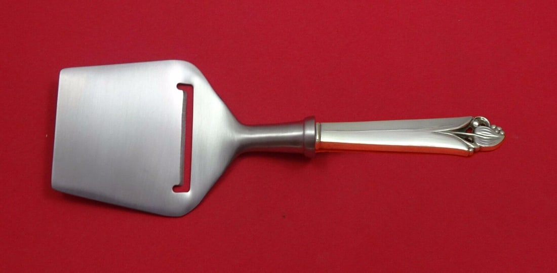 Frank Smith Woodlily Sterling Silver Cheese Plane 8.25 inches Custom: Frank Smith Woodlily Sterling Silver Cheese Plane 8.25 inches Custom This Woodlily cheese plane by Frank Smith is crafted from sterling silver and features a hollow handle with a flat cutting blade ma