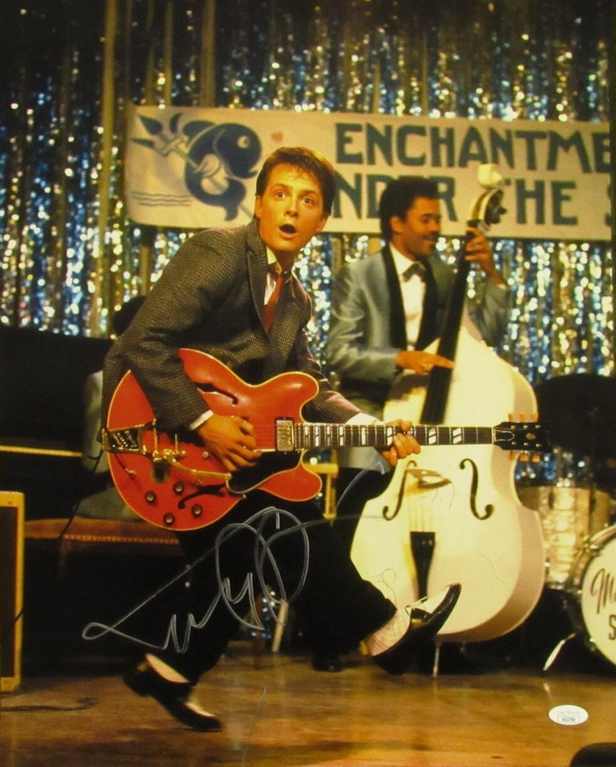 Michael J Fox Autographed 16x20 Back to the Future Photo JSA Certified: Michael J Fox Autographed 16x20 Back to the Future Photo JSA Certified This is an original 16x20 photo of Michael J. Fox from the iconic movie "Back to the Future," personally autographed by the actor