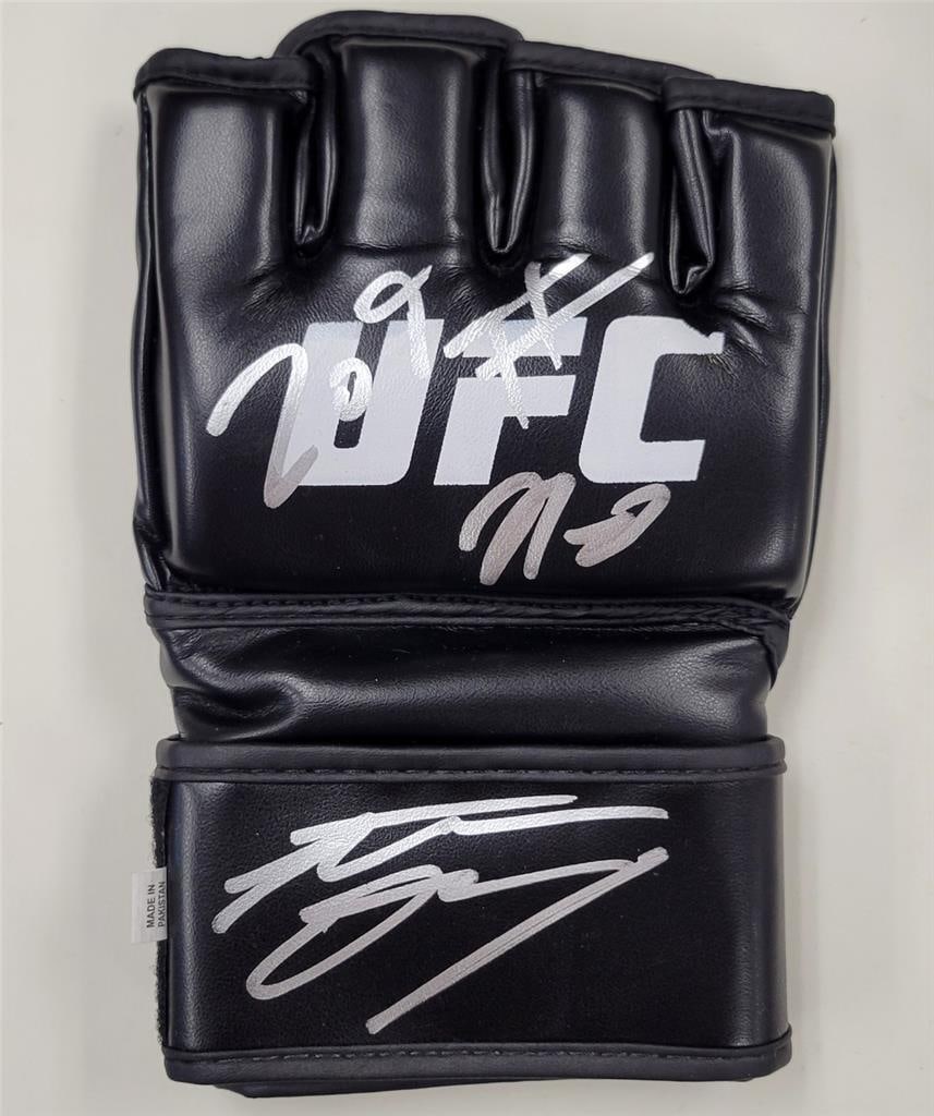 Nate Diaz Signed UFC Glove MMA Autograph Beckett Certified: Nate Diaz Signed UFC Glove MMA Autograph Beckett Certified This is an original UFC glove autographed by Nate Diaz, a prominent figure in Mixed Martial Arts (MMA). The autograph has been authenticated