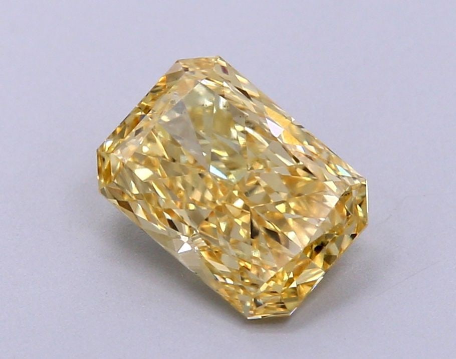 Loose Diamond - RADIANT 1.37ct Fancy Vivid Yellow VS1: Loose Diamond - RADIANT 1.37ct Fancy Vivid Yellow VS1 Source: This is a real non-mined Diamond that has been grown in a lab Shape: RADIANT Carats: 1.37 Color: Fancy Vivid Yellow Certification: IGI Vid