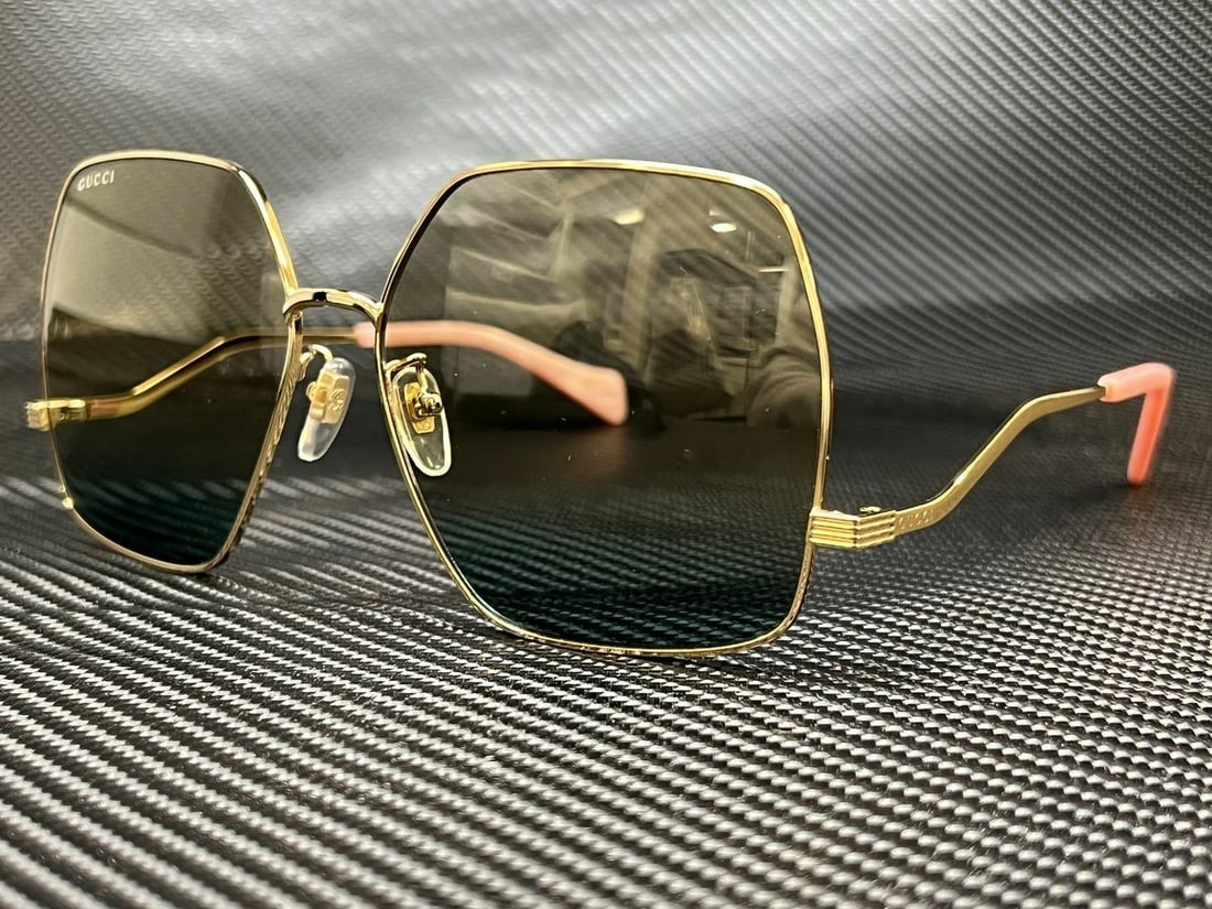 GUCCI GG1005S 001 Gold Hexagonal 61 mm Women's Sunglasses: GUCCI GG1005S 001 Gold Hexagonal 61 mm Women's Sunglasses Lens Technology: Gradient Frame Color: Gold Type: Sunglasses Uv Protection: UVA Lens Material: Plastic Frame Material: Metal Theme: Designer C