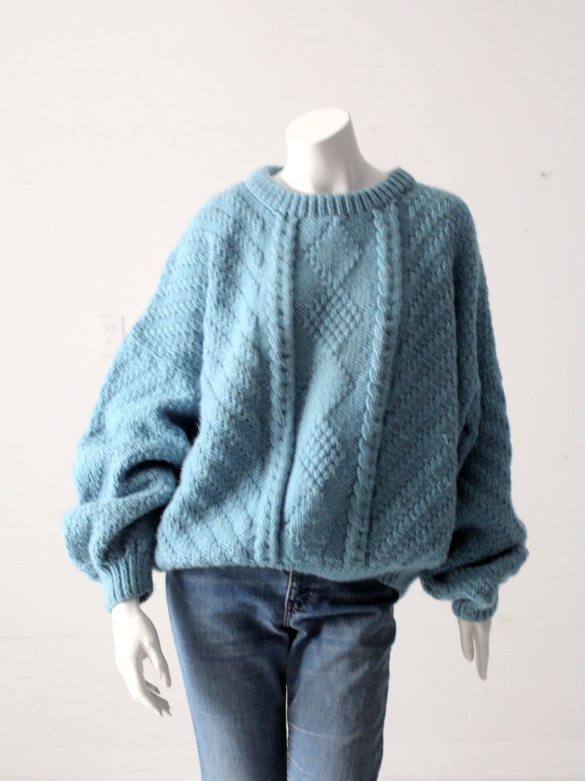 1980s Vintage Turquoise Balloon Sleeve Sweater with Geometric Knit: 1980s Vintage Turquoise Balloon Sleeve Sweater with Geometric Knit This is a 1980s vintage balloon sleeve sweater. The turquoise blue soft knit sweater features a lovely textured geometric knit patter