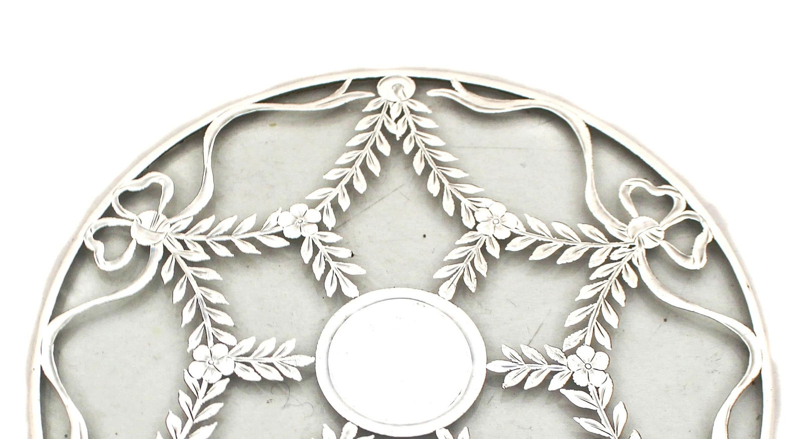 Sterling Silver Trivet: Sterling Silver Trivet Creator: Webster & Company (Manufacturer) Dimensions: Height: 1 in (2.54 cm)Diameter: 8 in (20.32 cm) Materials and Techniques: Glass Sterling Silver Place of Origin: United Sta