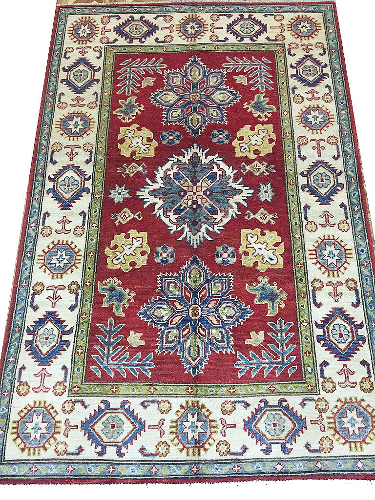 3'9 x 5'9 Afghan Handmade Kazak Wool Rug: 3'9 x 5'9 Afghan Handmade Kazak Wool Rug Free continental US Shipping Size in Feet: Width: 3'9 x Length: 5'9 Size in Inches: Width: 45 in x Length: 69 in Rug Type: Area Rug Colors: Red Ivory green blu