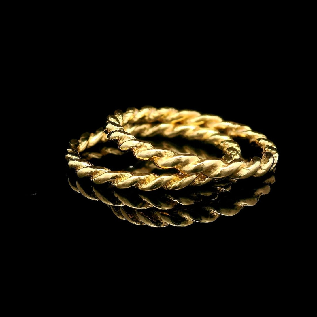14k Yellow Gold Twisted Cable Stack Band Ring Pair Size 6.5: 14k Yellow Gold Twisted Cable Stack Band Ring Pair Size 6.5 This exquisite pair of estate rings features a stylish twisted cable design, crafted from solid 14k yellow gold. The rings are a perfect add