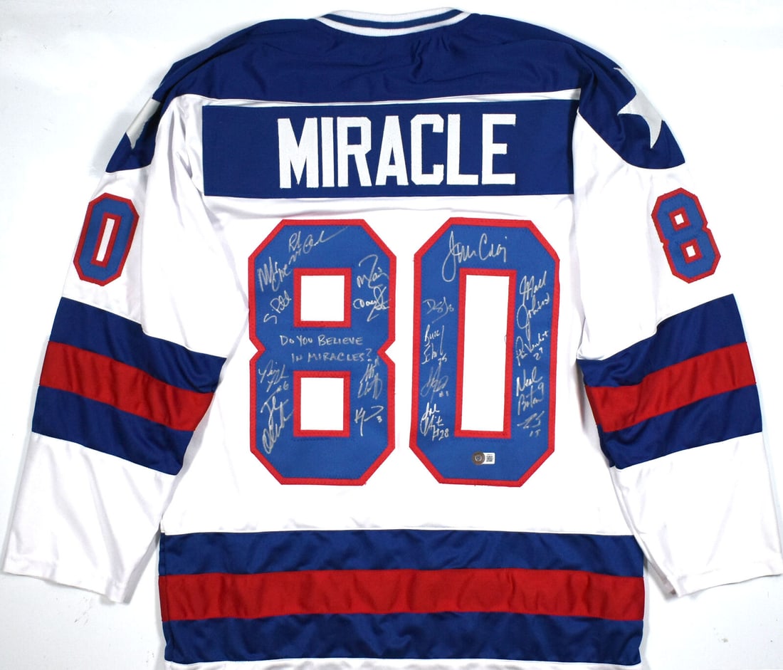 1980 Miracle on Ice Team USA Signed White Pro Style Jersey w/18 Sigs - Beckett W: 1980 Miracle on Ice Team USA Signed White Pro Style Jersey w/18 Sigs - Beckett W Sport: Football Product: Jersey Original/Reprint: Original Player: Steve Janaszak Bill Baker Dave Christian Ken Morrow