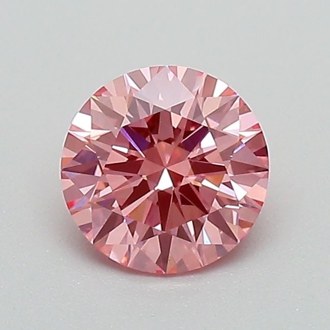 Ideal Loose Diamond - ROUND 0.71ct Fancy Vivid Pink VVS2: Ideal Loose Diamond - ROUND 0.71ct Fancy Vivid Pink VVS2 Source: This is a real non-mined Diamond that has been grown in a lab Shape: ROUND Carats: 0.71 Color: Fancy Vivid Pink Certification: IGI Vide