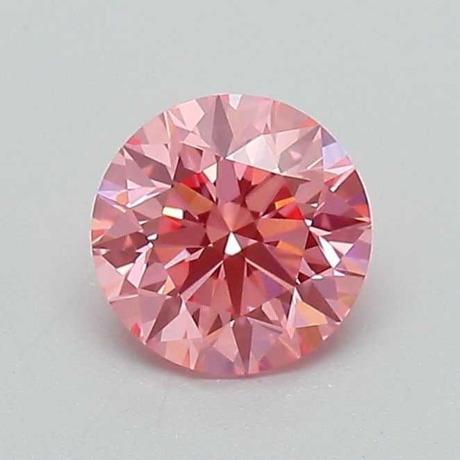 Loose Diamond - ROUND 0.71ct Fancy Vivid Pink VVS2: Loose Diamond - ROUND 0.71ct Fancy Vivid Pink VVS2 Source: This is a real non-mined Diamond that has been grown in a lab Shape: ROUND Carats: 0.71 Color: Fancy Vivid Pink Certification: IGI Video:
