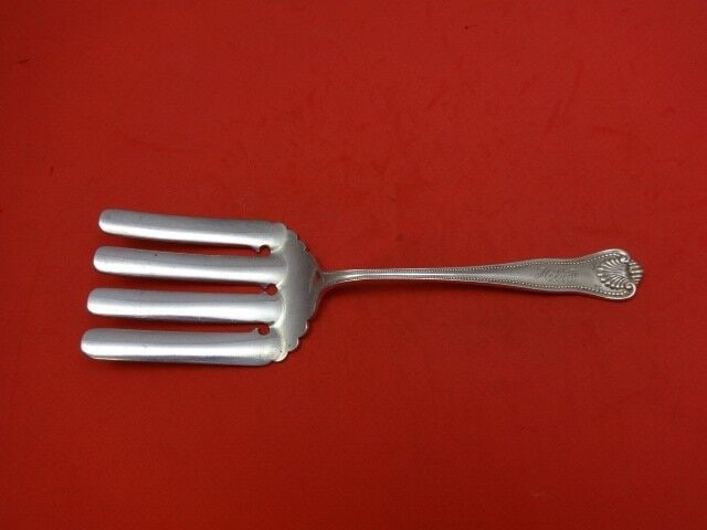 Frank Smith Newport Shell Sterling Silver Serving Fork 9 1/2in: Frank Smith Newport Shell Sterling Silver Serving Fork 9 1/2in Enhance your dining experience with this exquisite Newport Shell Asparagus Fork by Frank Smith. Crafted from high-quality sterling silver