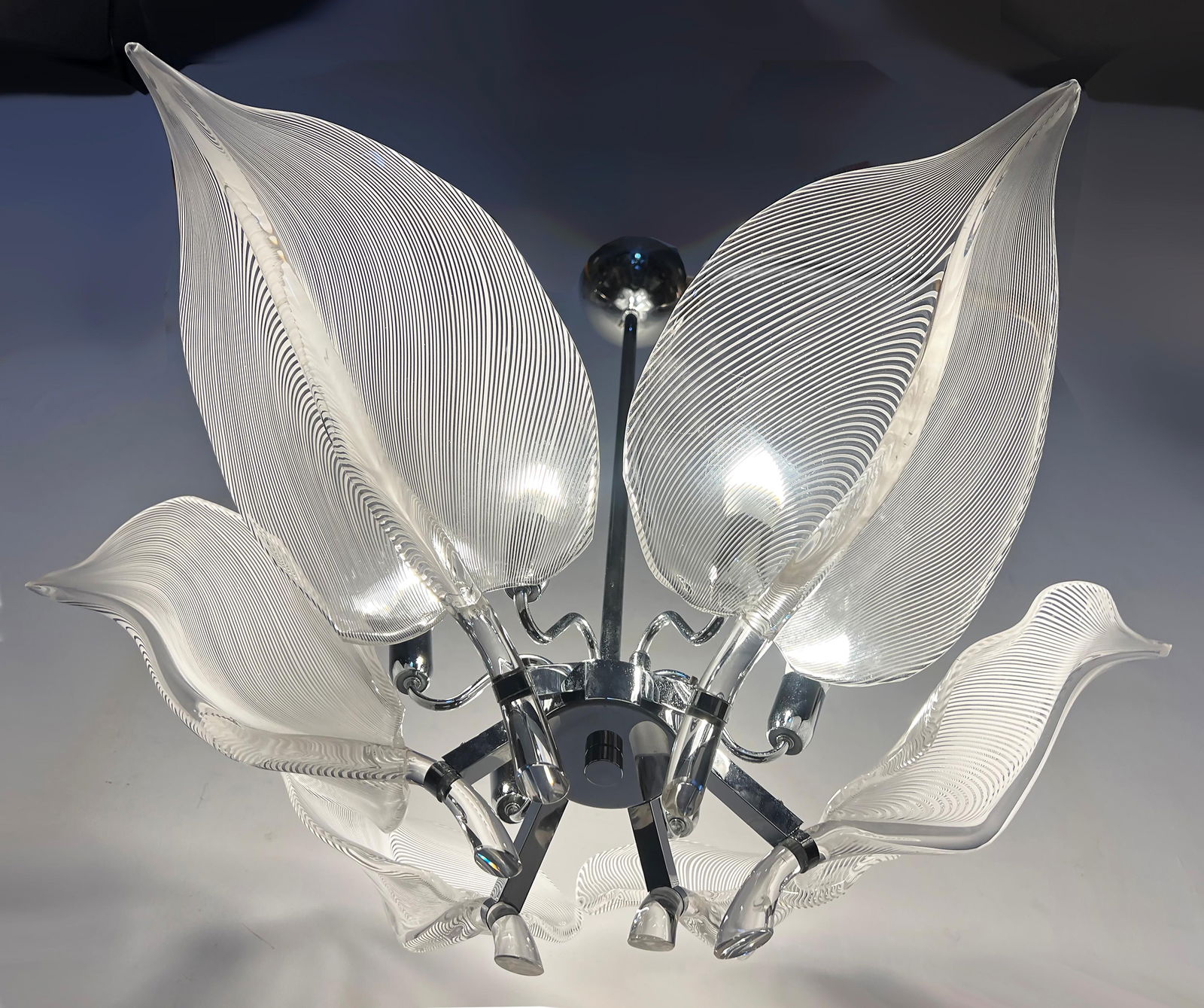 Franco Luce Seguso 6 Leaf Murano Glass Chandelier Chrome 24 x 36 x 36: Franco Luce Seguso 6 Leaf Murano Glass Chandelier Chrome 24 x 36 x 36 This stunning chandelier features a striking design with six leaf-shaped shades crafted from Murano glass, showcasing the exquisit