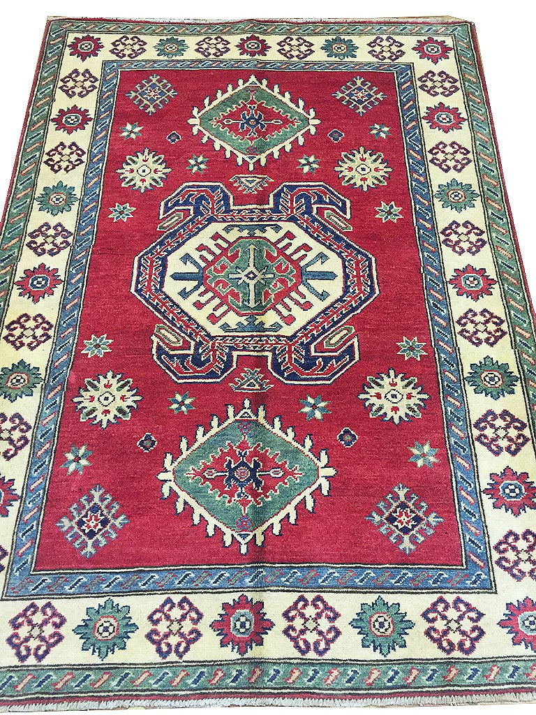 Handmade Wool Kazak Area Rug 4.3 x 6.0 Feet Pakistan Red Ivory Blue Green: Handmade Wool Kazak Area Rug 4.3 x 6.0 Feet Pakistan Red Ivory Blue Green Enhance your space with this exquisite 4'3 x 6'0 Pakistan Handmade Wool Kazak Rug. Crafted with meticulous care, this area rug