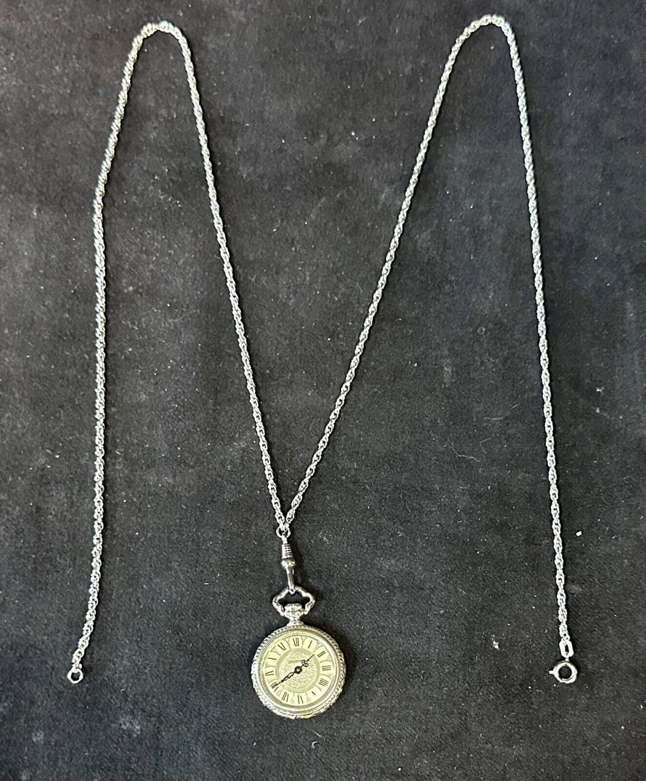 Bucherer Vintage Pendant Watch with 30 Inch Rope Chain: Bucherer Vintage Pendant Watch with 30 Inch Rope Chain Presenting a vintage Bucherer pendant watch elegantly paired with a 30" rope chain. This stylish necklace watch features a mechanical (manual) mo