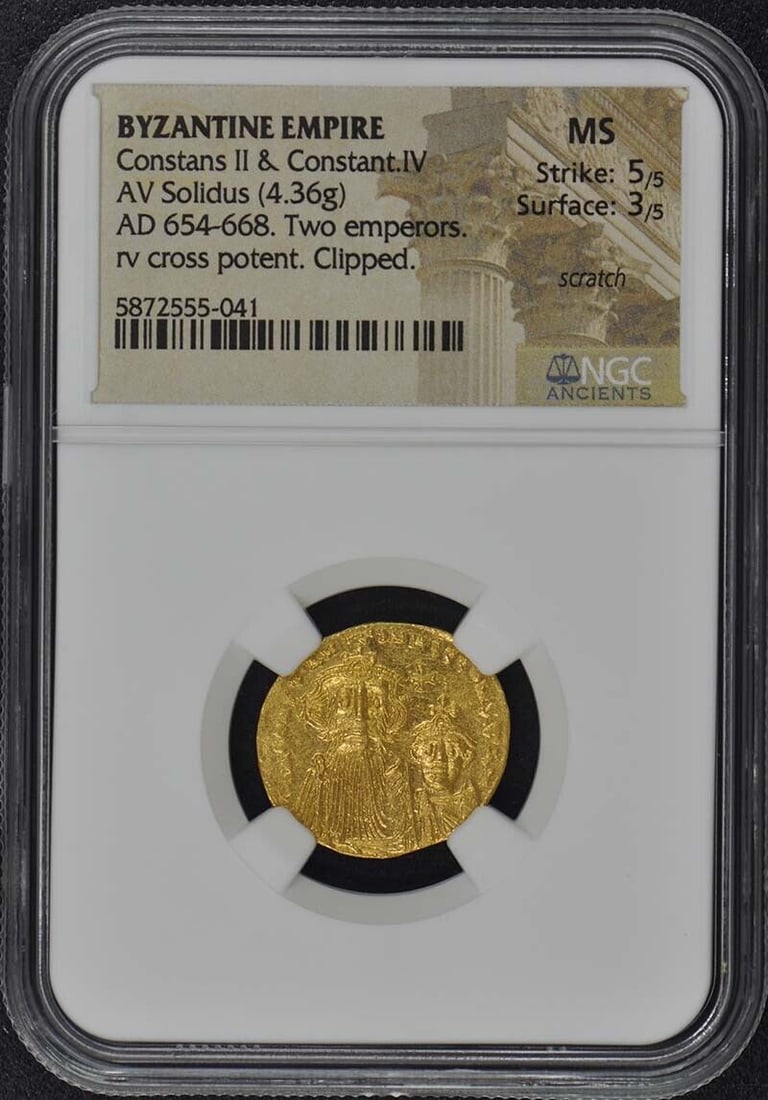 Byzantine Empire Gold Solidus Coin AD 654-668 NGC MS60: Byzantine Empire Gold Solidus Coin AD 654-668 NGC MS60 This Byzantine Empire gold solidus features the portraits of Emperors Constans II and Constant IV, dated AD 654-668. Certified by NGC with a grad