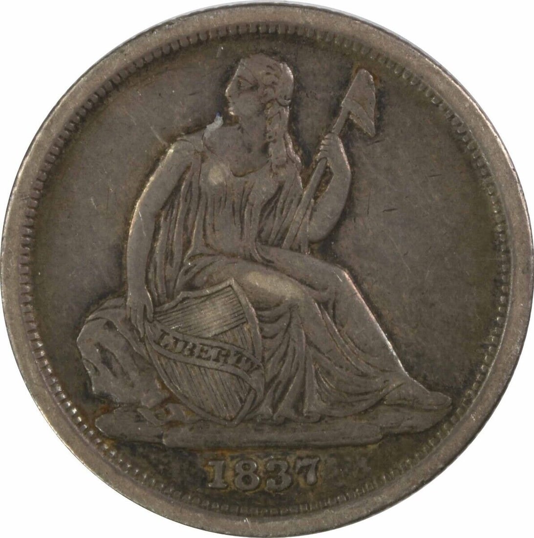 1837 Liberty Seated Silver Dime EF Circulated: 1837 Liberty Seated Silver Dime EF Circulated This 1837 Liberty Seated Silver Dime features a captivating design by Thomas Sully and Christian Gobrecht, showcasing a woman holding a shield and an axe.