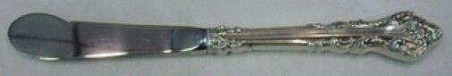 International Silver Silver Masterpiece Butter Spreader 6 1/2": International Silver Silver Masterpiece Butter Spreader 6 1/2" This exquisite butter spreader is a part of the Silver Masterpiece collection by International Sterling Silver. Crafted with a hollow han