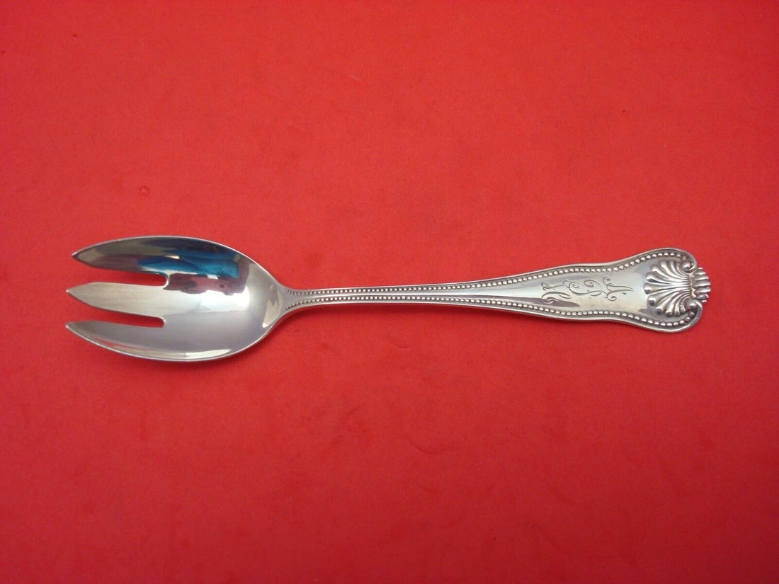 Frank Smith Newport Shell Sterling Silver Ice Cream Fork 5.5 inches: Frank Smith Newport Shell Sterling Silver Ice Cream Fork 5.5 inches This exquisite ice cream fork showcases the elegant Newport Shell pattern by renowned maker Frank Smith. Crafted from high-quality s